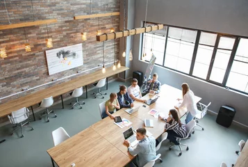 Tapeten Young people having business meeting in modern office © Pixel-Shot