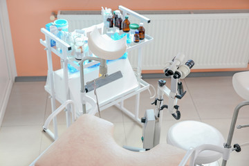 Gynecological chair with modern colposcope in clinic