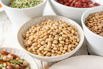 Assortment of legumes on white table