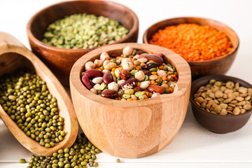 Assortment of legumes on white table