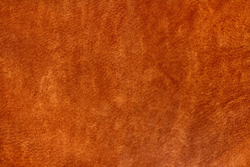 Texture of brown suede. Matte surface of pigskin suede jacket.  Material to create clothes and accessories in bohostyle. Close-up. 
