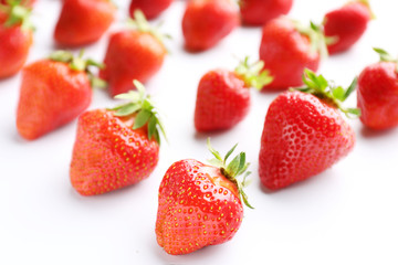 Ripe red strawberry on white background