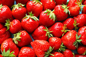 Many ripe red strawberry as background