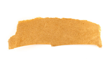A piece of torn brown craft paper, shot from the top on a white background with a place for text