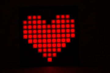 Heart closeup on a black background. Valentine's Day.