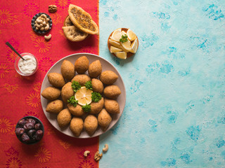 Fototapeta na wymiar Traditional Arabic kibbeh with lamb and pine nuts.
