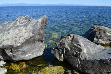 Fototapeta na wymiar Baikal, beach, summer, nature, stones, mountains, water, forest.