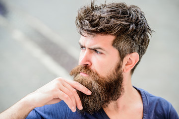 Fototapeta premium Making hard decision. Bearded man concentrated face. Thoughtful mood concept. Making important life choices. Man with beard and mustache thoughtful troubled. Hipster with beard thoughtful expression