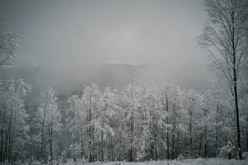 Winter hike in fresh snow to catch sun setting down