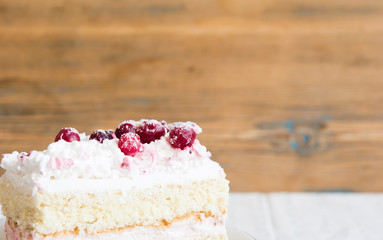 slice cake with white chocolate and cranberry on a plate