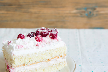 slice cake with white chocolate and cranberry on a plate