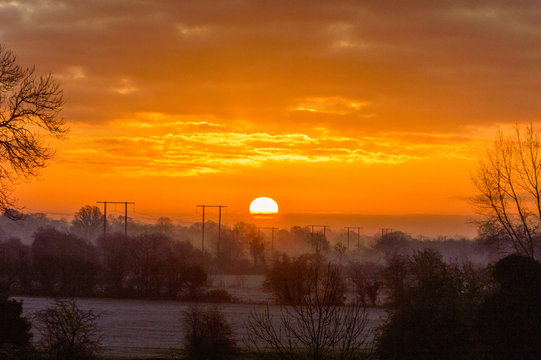 Sunrise over Field with mist