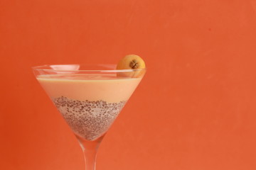glass with chia and medlars pudding