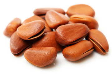 Pine nuts on white background 