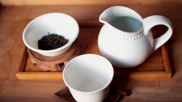 This is a close up shot of a loose leaf oolong tea (ceremony) session. Lighting was all natural from the sunset.