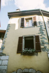 Old city scene: windows with vintage wooden shutters
