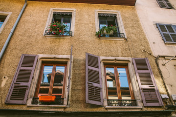 Old city scene: windows with vintage wooden shutters