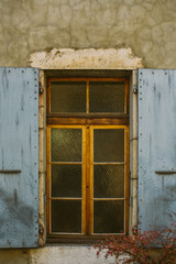 Old city scene: windows with vintage wooden shutters