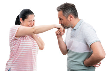 Man kissing woman hand