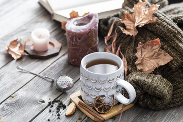 Obraz na płótnie Canvas Cozy autumn morning breakfast in bed still life scene. Steaming cup of hot coffee, tea standing near window. Fall.