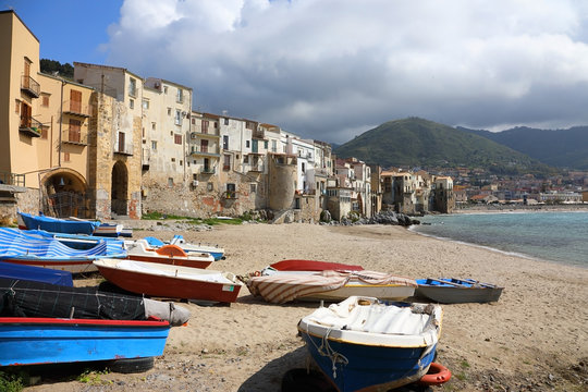 Coastline with boats of the old town of Cefalu