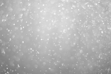 Bokeh background and bubbles reflecting black and white light