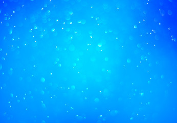 Bokeh background and bubbles reflecting blue sea light