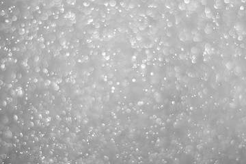 Bokeh background and bubbles reflecting black and white light