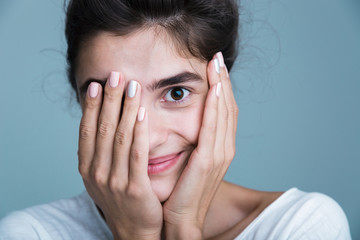 Fototapeta premium Close up portrait of a pretty young brunette woman