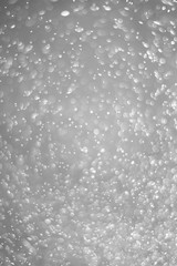 Bokeh background and bubbles reflecting black and white light