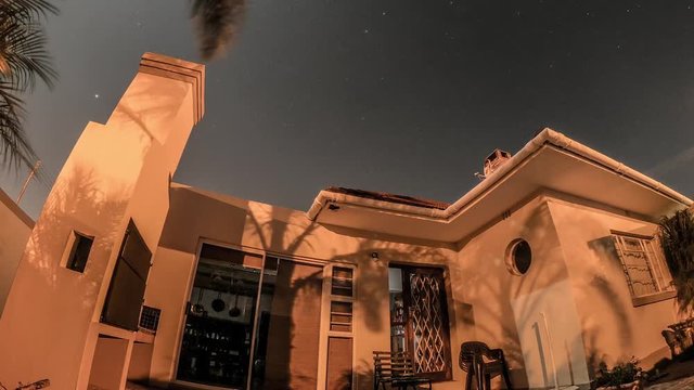 Night lapse of a calm clear sky night turning into a stormy night.