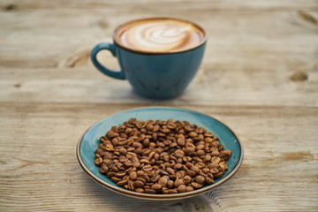 Latte coffee, coffee beans on the table