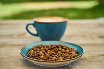 Latte coffee, coffee beans on the table