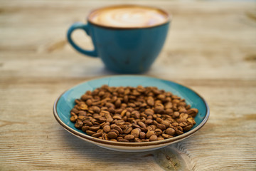 Latte coffee, coffee beans on the table