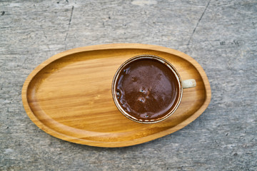 Delicious Turkish coffee on wooden dish
