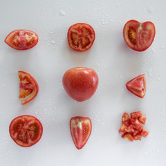 Chopped raw tomatoes on white background, food pattern