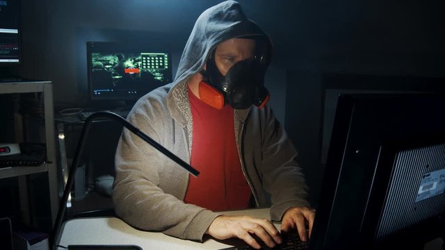 Bio-Terrorist types in computer code wearing a gas mask.