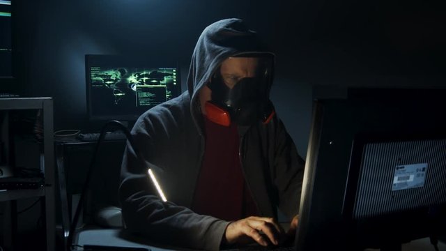 Bio-Terrorist types in computer code wearing a gas mask.
