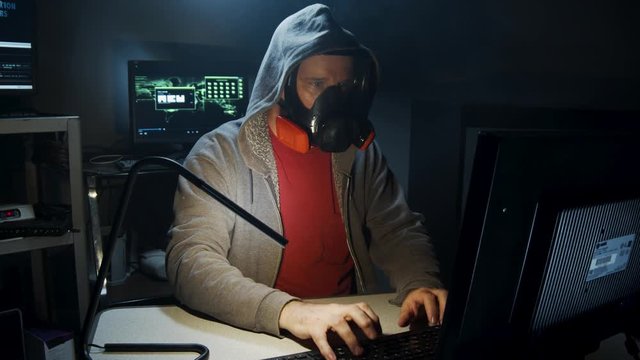 Bio-Terrorist types in computer code wearing a gas mask.