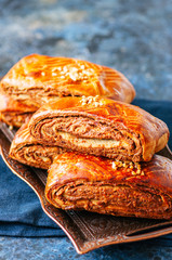 Traditional turkish pastry roll with chocolate and nuts filling.