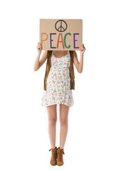 Naklejka premium full length view of pregnant hippie woman holding placard with inscription isolated on white