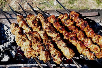 Preparing pork shashlik on the charcoal mangal. Pork grill, Pork shashlik. Marinated shashlik...