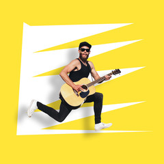 Fototapeta na wymiar Guitar player isolated over yellow background. He is singing, screaming and jumping. Hipster guitar player with beard and black clothes
