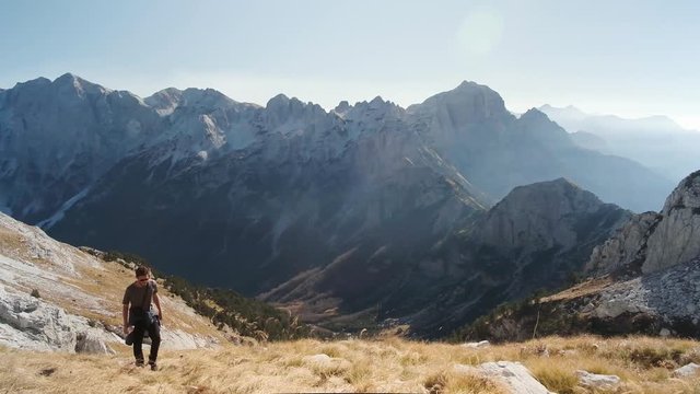 Human hiking in the Alps of Albania. Beautiful summer's day in the mountains