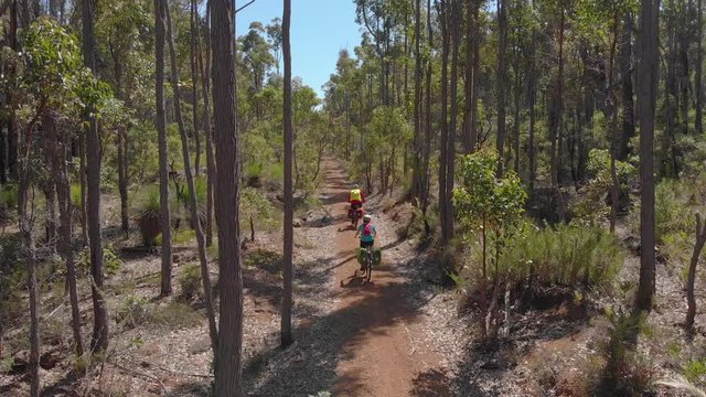 Bike touring through Western Australian bush Munda Biddi Trail Aerial Drone Shot