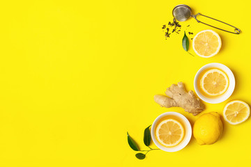 Ginger lemon tea or detox drink in a white cup on a bright yellow background. Healthy eating concept. Copy space.