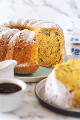 Homemade carrot bundt cake with walnuts and coffee