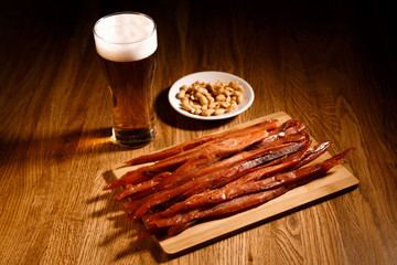 Fish barbecue with glass of bear