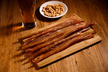 Fish barbecue with glass of bear