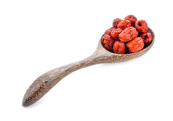 Chinese jujube isolated In wooden spoon on white background